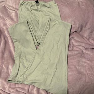 Light green ribbed flare pants.